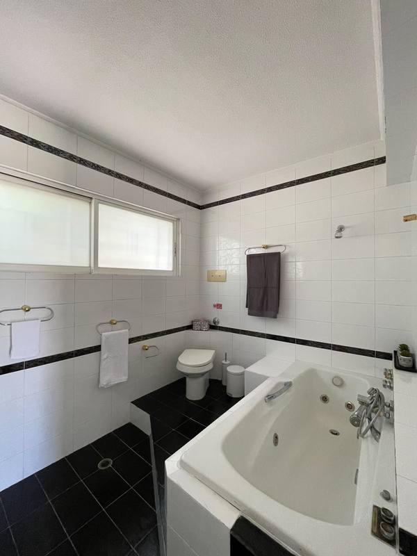 Bathroom with corner bathtub